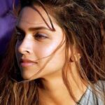 Deepika Padukone looking confident and smiling, discussing women making a pass being a bigger compliment.