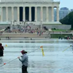 Close-up of peeling paint on the Trump Reflecting Pool, highlighting ongoing maintenance issues.