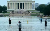 Close-up of peeling paint on the Trump Reflecting Pool, highlighting ongoing maintenance issues.
