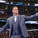 John Cena in a WWE ring, looking thoughtful