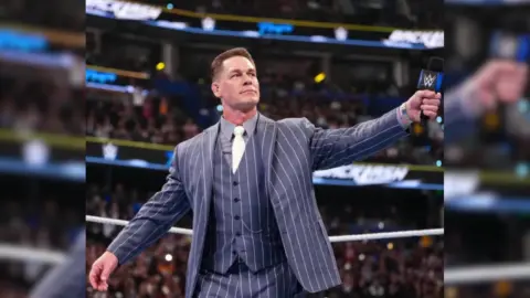 John Cena in a WWE ring, looking thoughtful