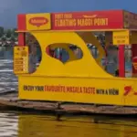 Floating Maggi point on Dal Lake, Srinagar, offering a unique culinary experience amidst stunning mountain views.