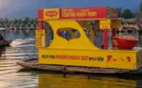 Floating Maggi point on Dal Lake, Srinagar, offering a unique culinary experience amidst stunning mountain views.