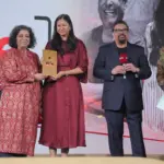 The Table Mumbai restaurant interior with happy diners celebrating their NDTV Food Awards 2026 win.