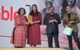 The Table Mumbai restaurant interior with happy diners celebrating their NDTV Food Awards 2026 win.