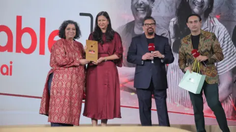 The Table Mumbai restaurant interior with happy diners celebrating their NDTV Food Awards 2026 win.