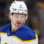Bowen Byram in action on the ice, with NHL insider Darren Dreger's report fueling trade rumors.
