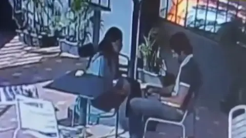 Siya Goyal, a suspect in the Ketan Agarwal cafe murder case, is seen during a cafe meeting.