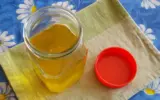 Woman performing a ghee purity test at home using a simple method.