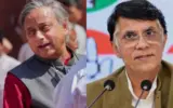 Shashi Tharoor speaking at a podium, with a Congress party symbol visible.