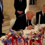US and Iran flags with a question mark symbolizing the uncertainty of the Iran nuclear deal negotiations.