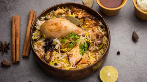 Customer discovers a dead fly in their biryani, leading to a court order for compensation.