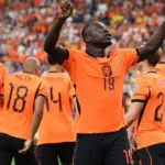 Jurrien Timber of the Netherlands celebrates scoring a goal against Sweden during a World Cup 2026 qualifier.