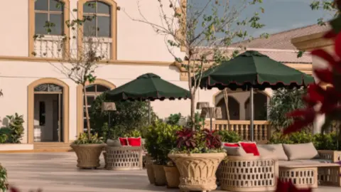 Rosso Pune restaurant interior with elegant seating and wine displays
