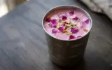 A refreshing glass of Chabeel, a traditional Punjabi drink, served cold with ice and garnished with mint leaves, perfect for summer.