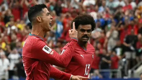 Cristiano Ronaldo celebrates scoring a goal for Portugal against Uzbekistan in Houston.