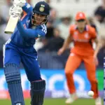 Smriti Mandhana celebrating a milestone during the India vs Netherlands Women's T20 World Cup 2026 match.