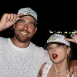 Taylor Swift and Travis Kelce in a candid moment, fueling wedding rumors.