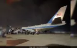 Air Force One aircraft on the tarmac with a Qatari jet in the background.