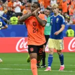 Netherlands players celebrate scoring a goal during their World Cup match against Sweden.