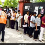NEET re-exam 2026 security measures in place with students taking the test under camera surveillance.