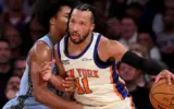 Jalen Brunson embraces Mitch Johnson after a game, highlighting their strong bond.