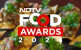 Chef presenting an award at the NDTV Food Awards ceremony, highlighting culinary talent recognition.