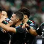 Mexico players celebrating after qualifying for the 2026 World Cup knockouts.