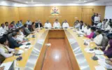 Karnataka government officials reviewing beneficiary lists for welfare schemes.