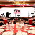 Chefs celebrating on stage at the NDTV Food Awards 2026, holding trophies.