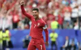 Cristiano Ronaldo celebrating a goal during a World Cup match, highlighting his record-breaking achievement.