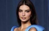 Emily Ratajkowski at an event, looking thoughtful.
