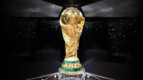 Close-up of the FIFA World Cup trophy, highlighting its gold