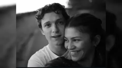Tom Holland and Zendaya smiling together