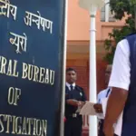 CBI officials apprehending a suspect in connection with the 2021 Bengal post-poll violence murder case.