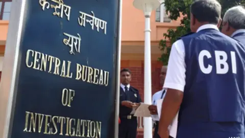 CBI officials apprehending a suspect in connection with the 2021 Bengal post-poll violence murder case.