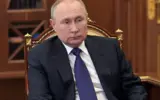 Russian flag with European Union flag in the background, symbolizing diplomatic talks.