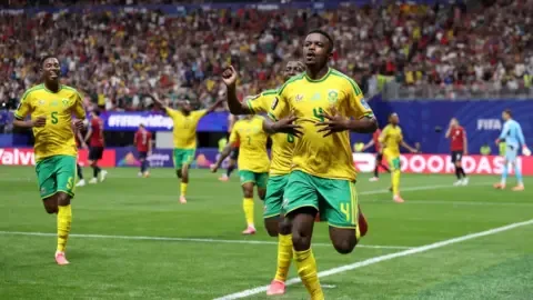 South Africa players celebrate after a match, keeping their FIFA World Cup knockout dream alive.