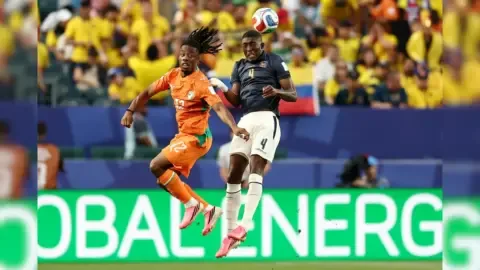 Elye Wahi, Ivory Coast forward, looking concerned during a press conference regarding his denied entry into Canada for the FIFA World Cup 2026 due to a betting probe.