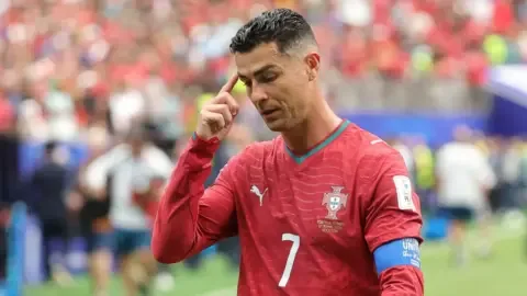 Cristiano Ronaldo in a Portugal World Cup match, looking frustrated.