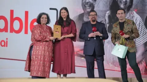 The Table Mumbai restaurant interior with happy diners celebrating their NDTV Food Awards 2026 win.