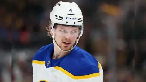 Bowen Byram in action on the ice, with NHL insider Darren Dreger's report fueling trade rumors.