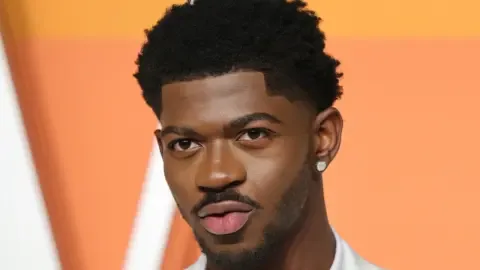 Lil Nas X discusses his bipolar diagnosis, describing his experience as 'living life on extreme hard mode'.