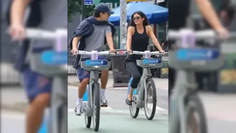 Timothée Chalamet and Kylie Jenner riding bikes together in New York City.