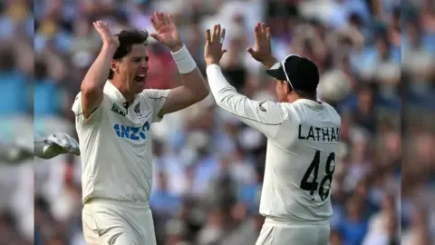 New Zealand players celebrate a wicket during the second Test against England at The Oval.