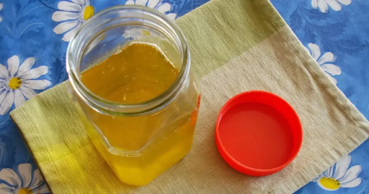 Woman performing a ghee purity test at home using a simple method.