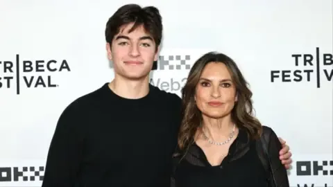Mariska Hargitay's son, August, wearing a custom t-shirt tribute at the Knicks parade.