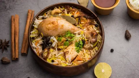 Customer discovers a dead fly in their biryani, leading to a court order for compensation.