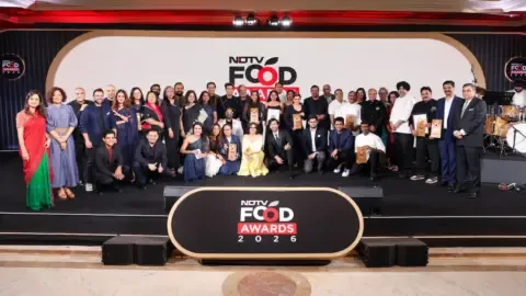 Aminia restaurant staff celebrating their win at the NDTV Food Awards 2026 for Restaurant of India.