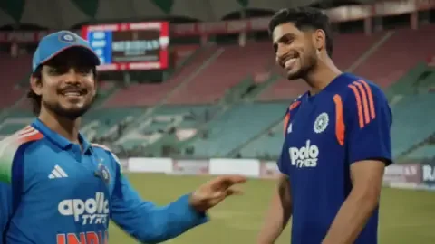 Ishan Kishan playfully teases Shubman Gill during a cricket match.